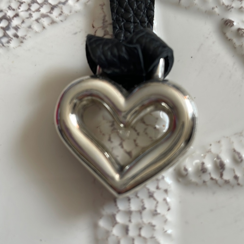 Brighton heart shaped pendant with black leather straps as necklace